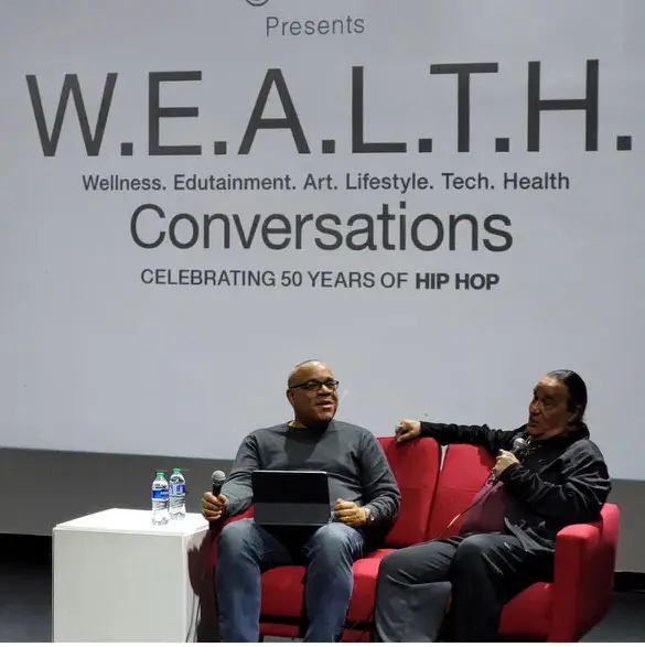 Graham Dillard interviewing photographer Ernie Paniccioli at W.E.A.L.T.H. Conversations celebrating 50 years of hip hop